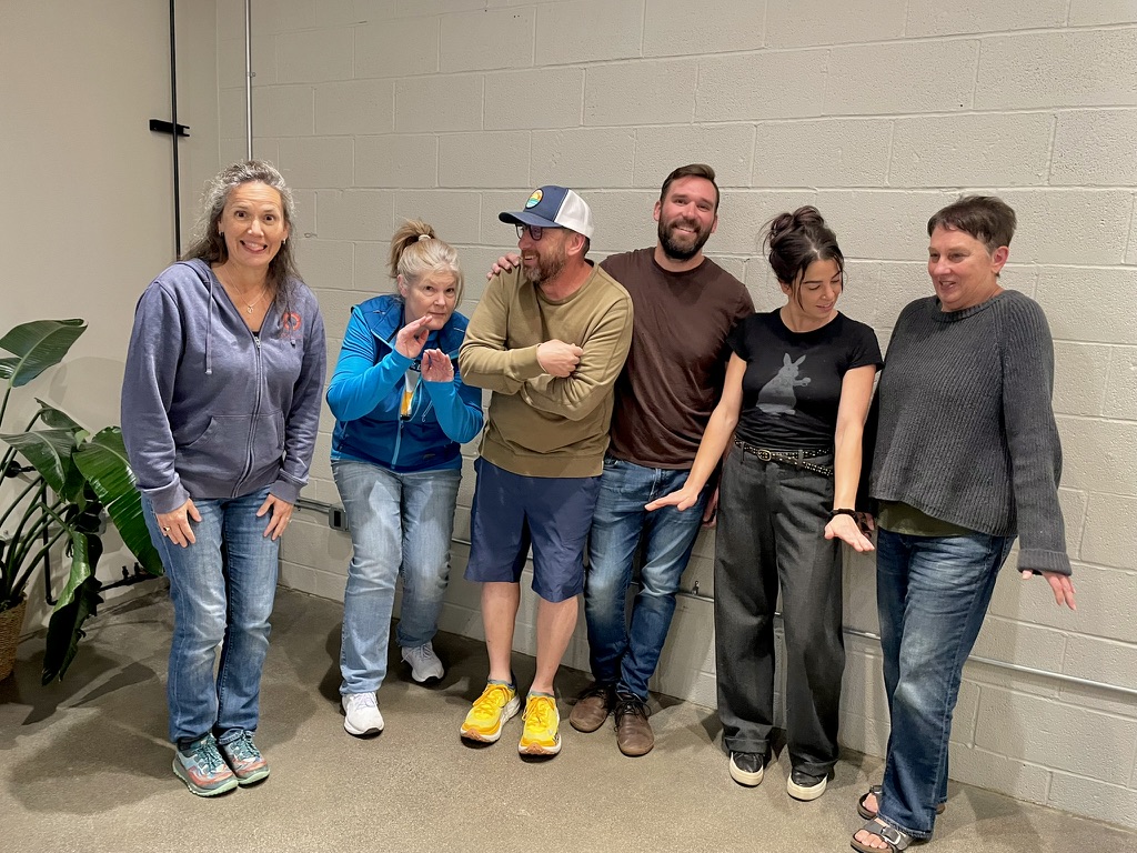 Bend Institute of Comedy students laughing together