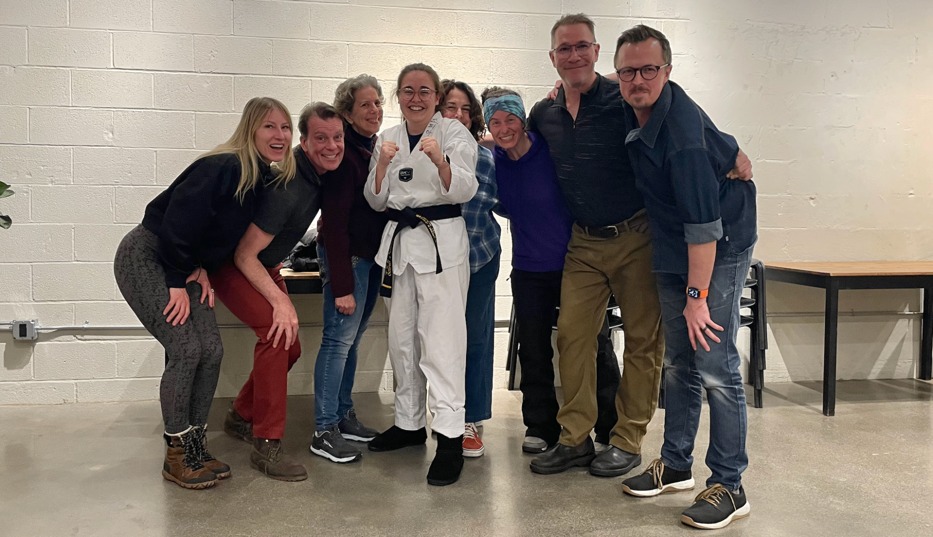 Group celebrating a black belt achievement