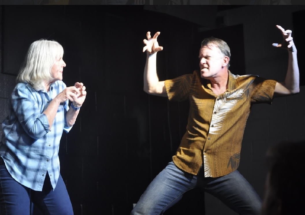Two performers in a high-energy scene